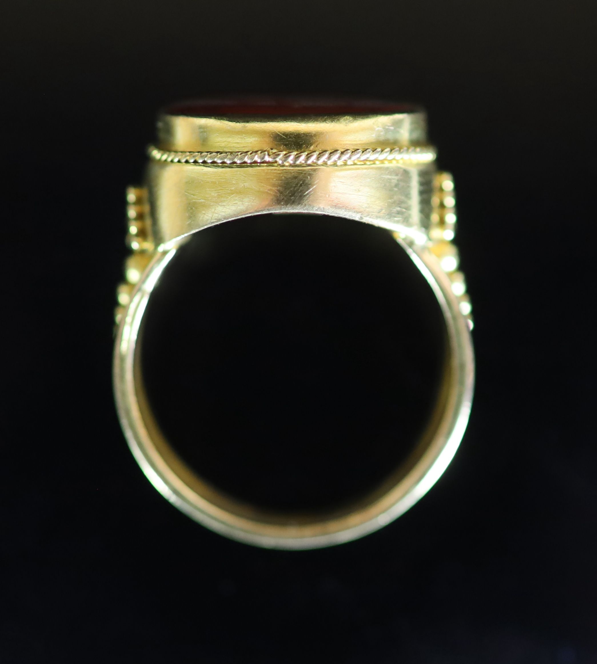 A Venetian 22ct gold and antique oval carnelian set signet ring